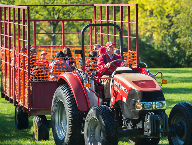 President Barchi driving a tractor